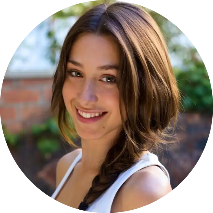 A young woman with brown hair, a subtle smile, and a single braid.